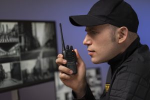 portrait-male-security-guard-with-radio-station-camera-screens (2) (1)